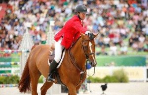 a rider patting a horse