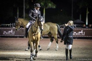 rider getting coached on a horse